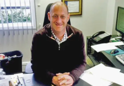 Scott Gruberger, EA, at his desk